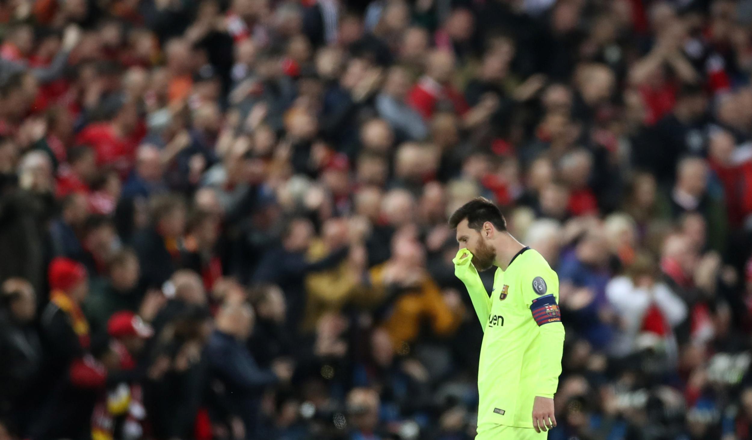 A dejected Messi leaves the Anfield.