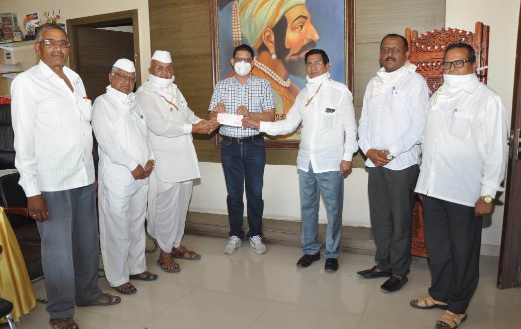 check of Rs. 1 lakh to C.M's Assistance Fund on behalf of Khandgaon Devasthan