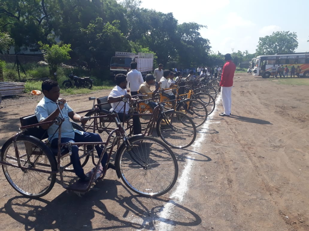 Organize a three wheeler cycle competition for the disabled in solapur