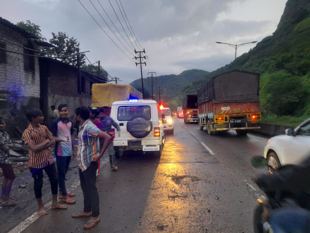 Damaged houses and gathered local residents due to landslides in Mumbai