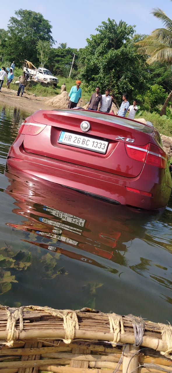 Depressed man sinks BMW car in Cauvery river at karnataka
