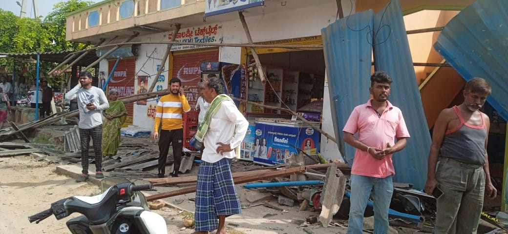 Shades in front of broken shops