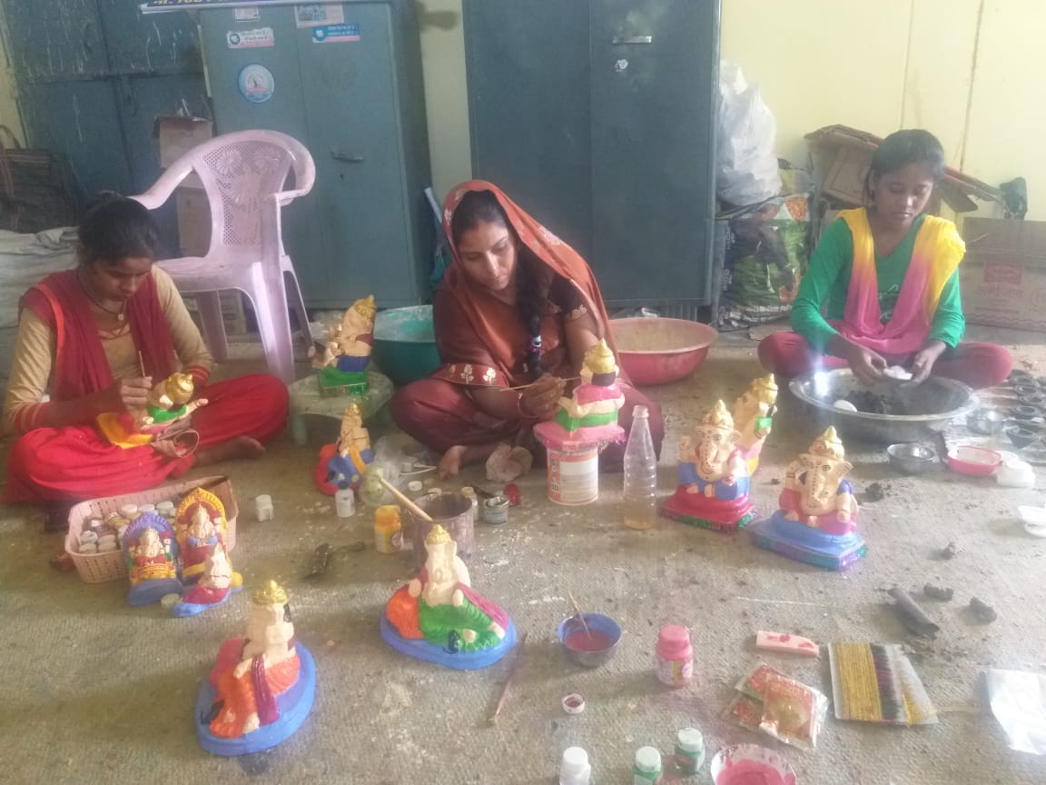 Women making idols of Lord Ganesha