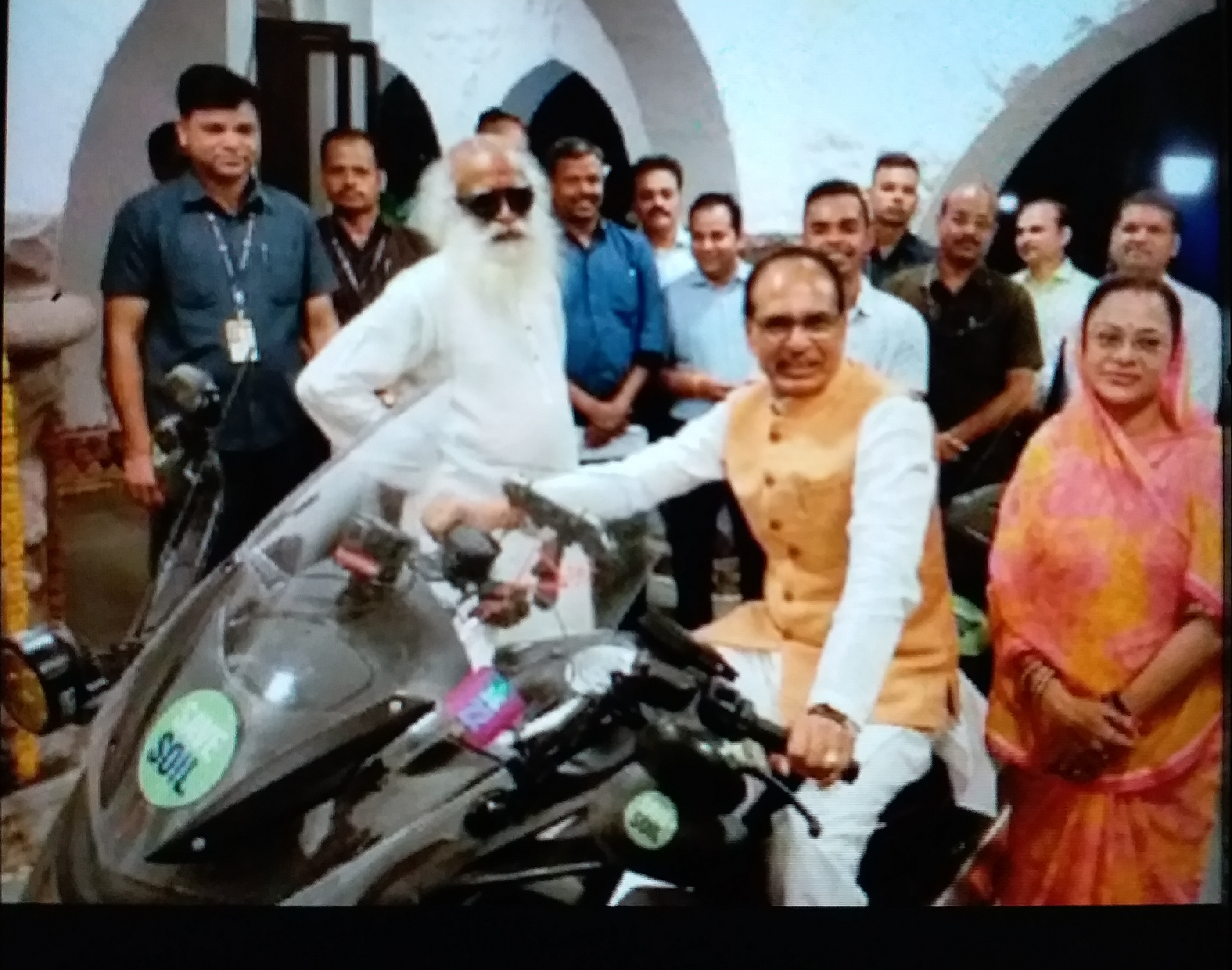 CM Shivraj drives Jaggi Vasudev bike