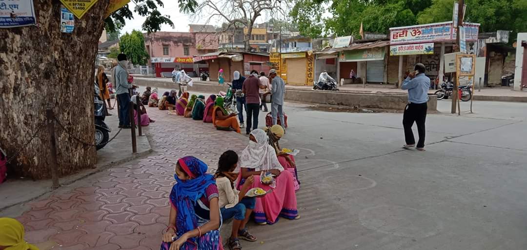 Helping the Poor Group is helping the beneficiaries standing outside the bank in burhanpur