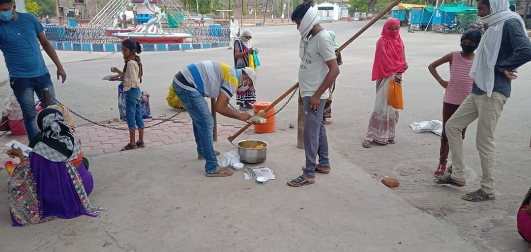 Helping the Poor Group is helping the beneficiaries standing outside the bank in burhanpur