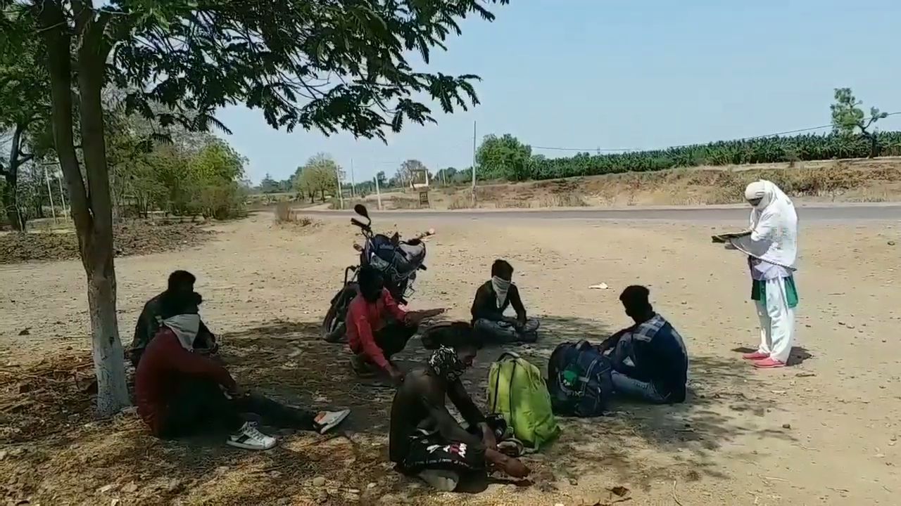 Workers sitting under trees tired from traveling