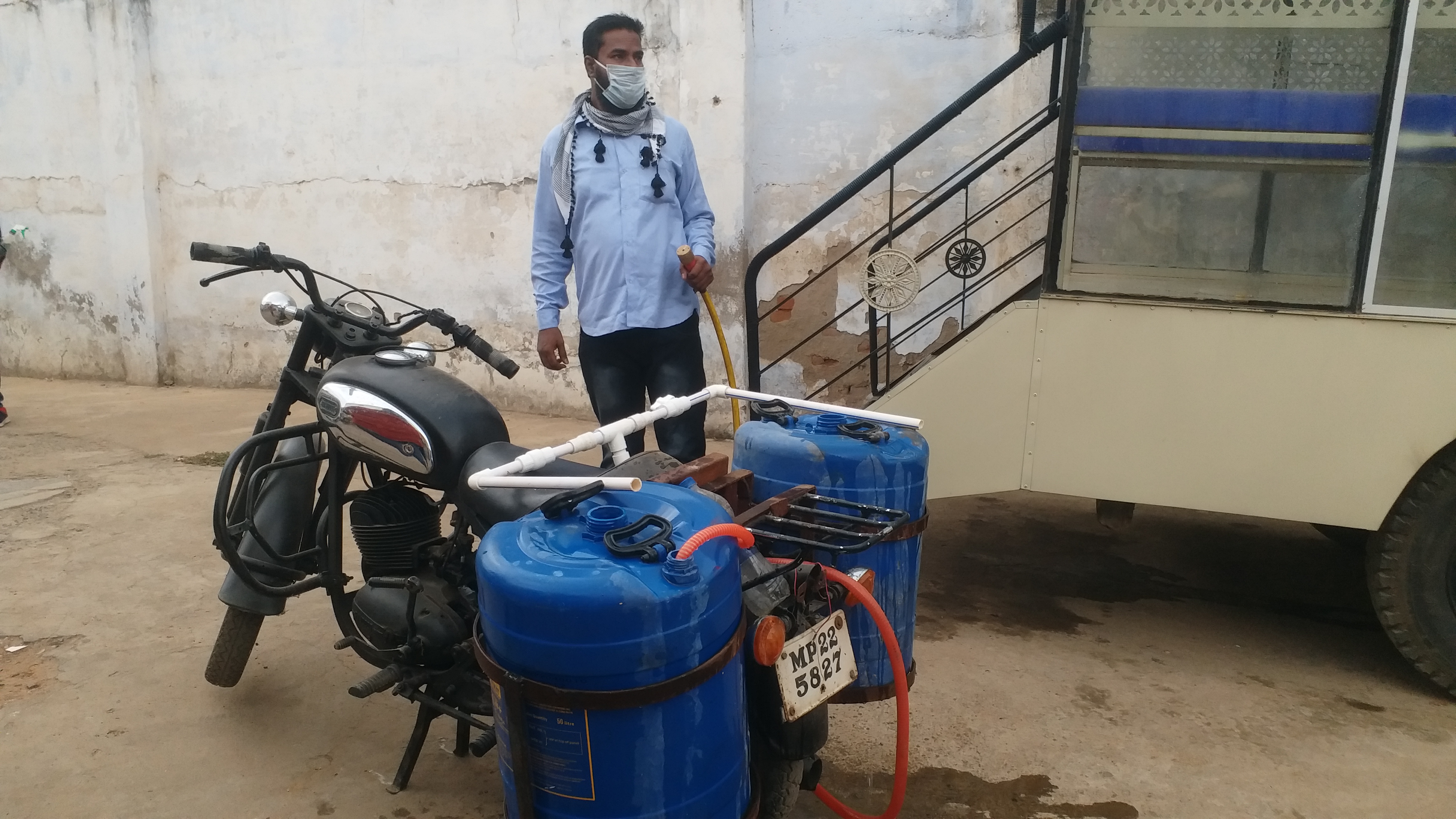 Hussafi Khan with sanitizer bike