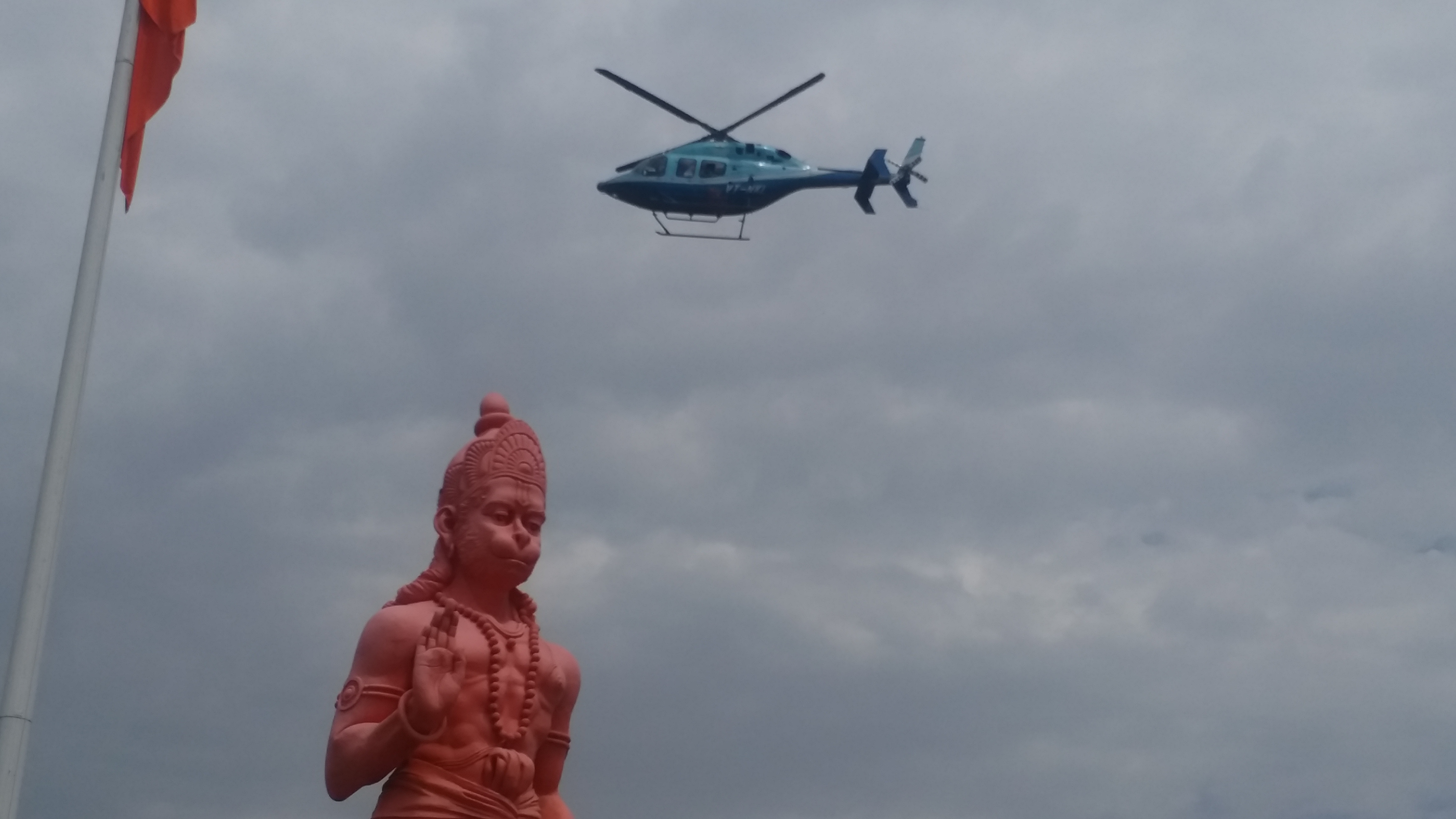 mp nakulnath shower flowers on god hanuman