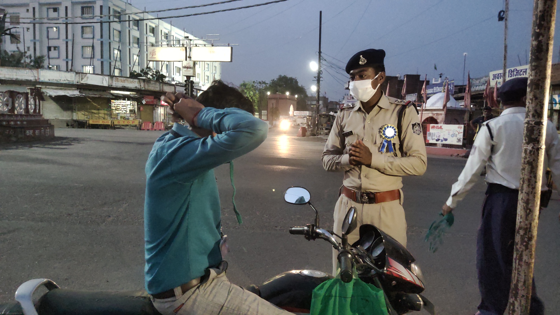 Police appealing people to apply masks with folded hands