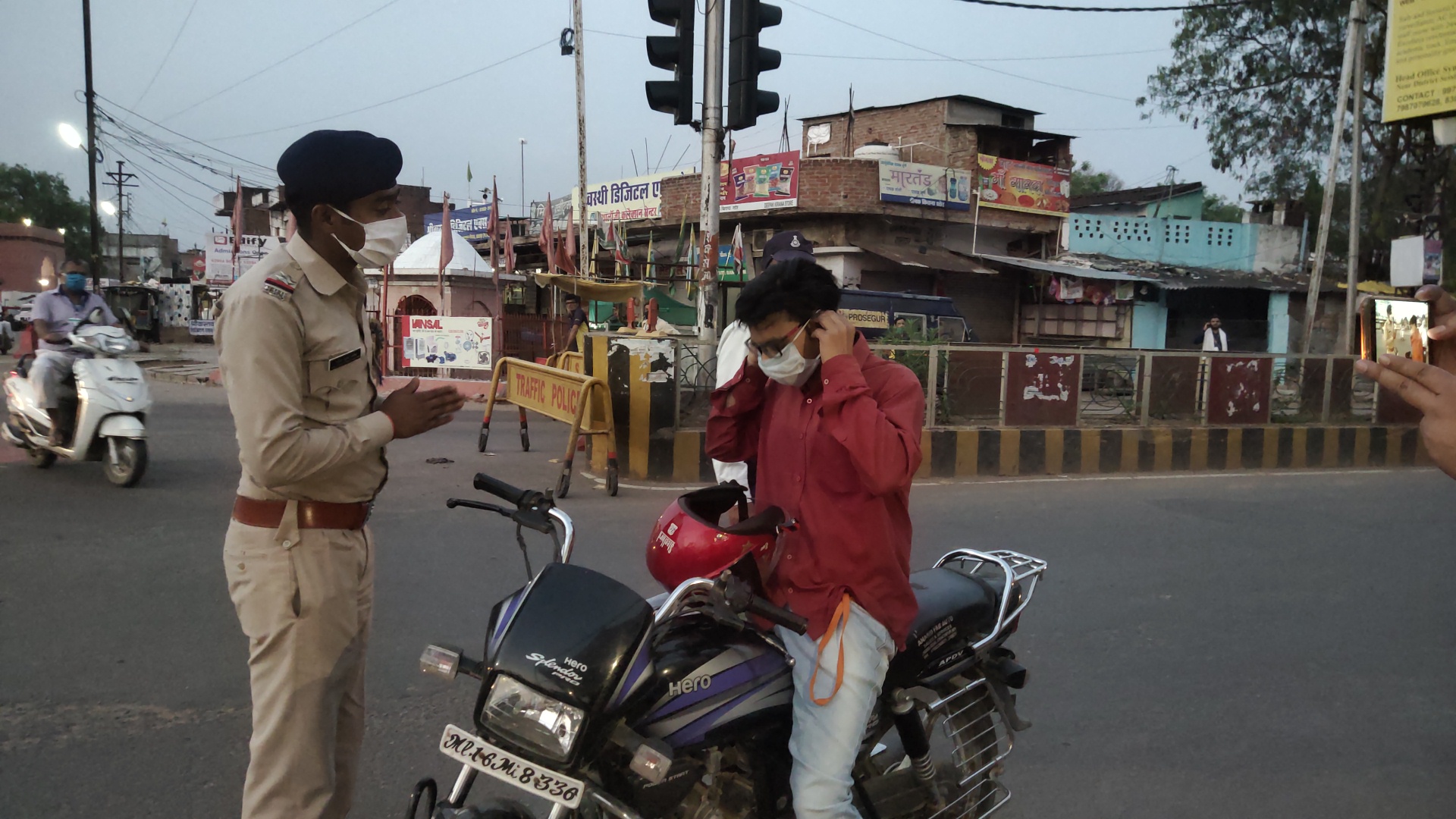 Police appealing people to apply masks with folded hands