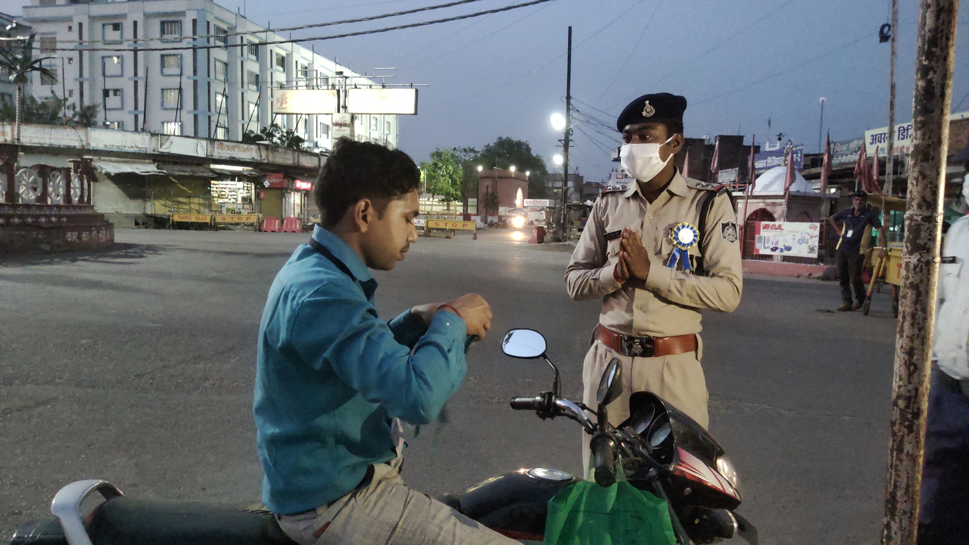 Police appealing people to apply masks with folded hands