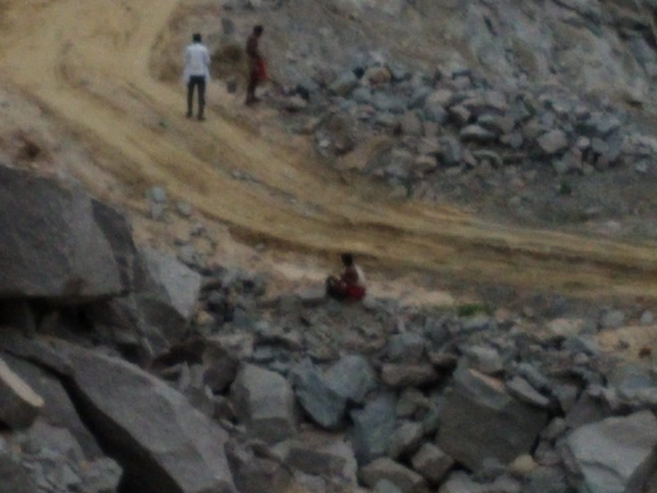 laborers working in the stone quarry without safety