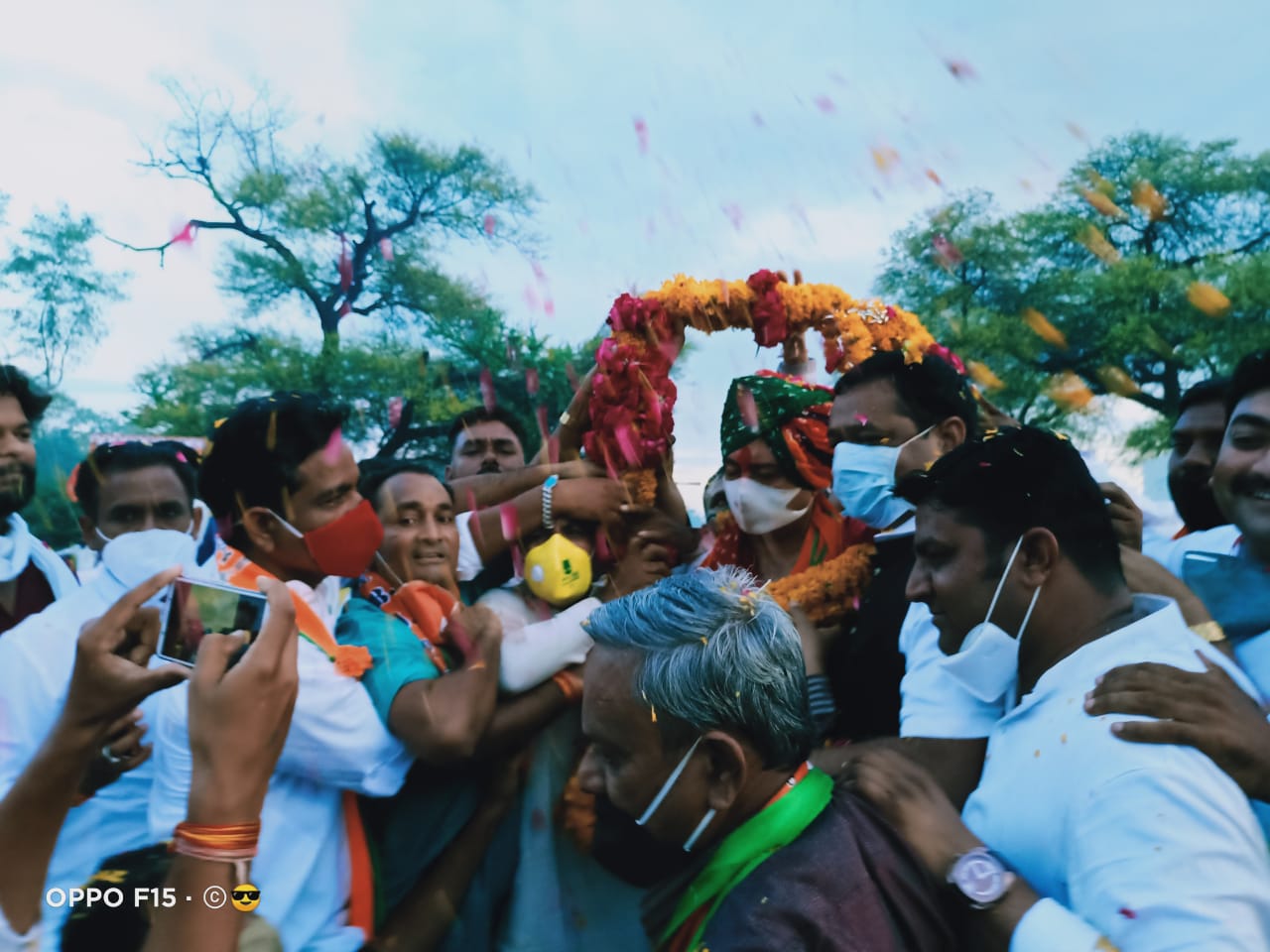 BJP workers welcomed by garland