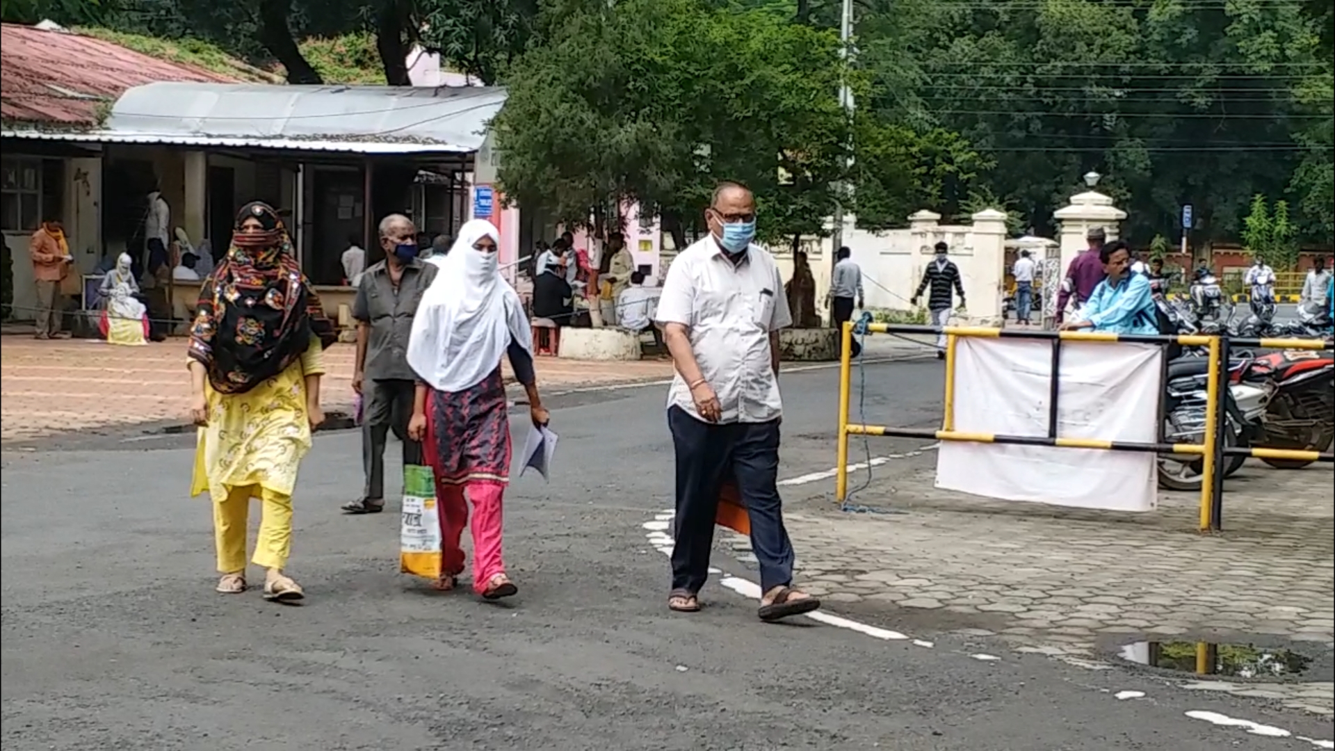 People walking around wearing masks