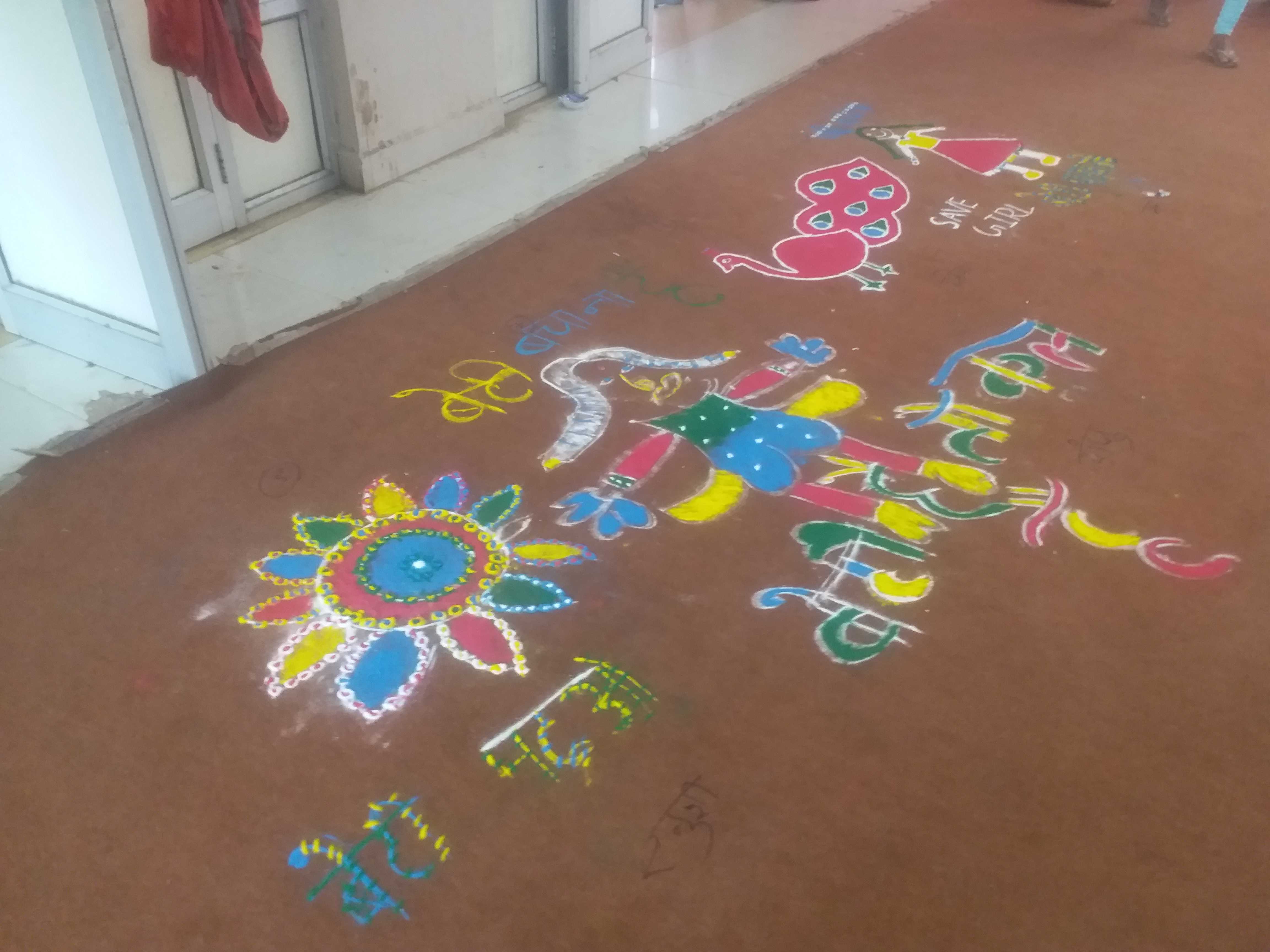 Girls made colorful rangolis