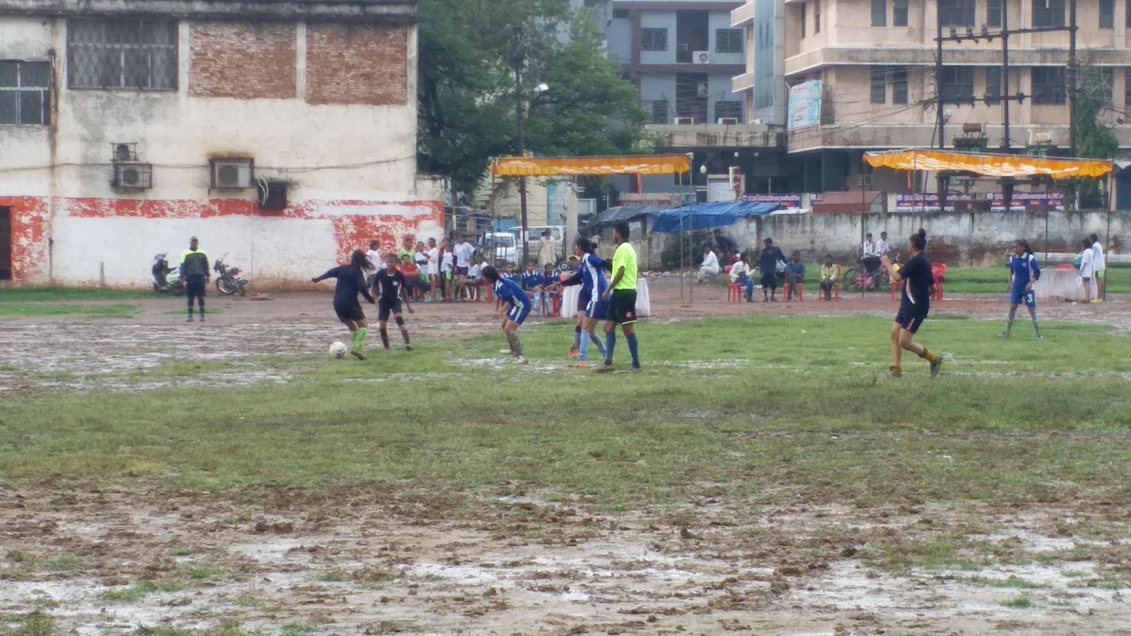 Players playing in the mud-soaked field