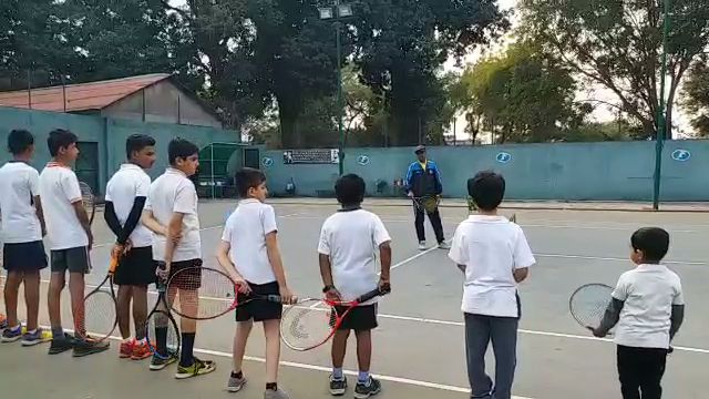 Coach Sheikh Receipt giving training to children