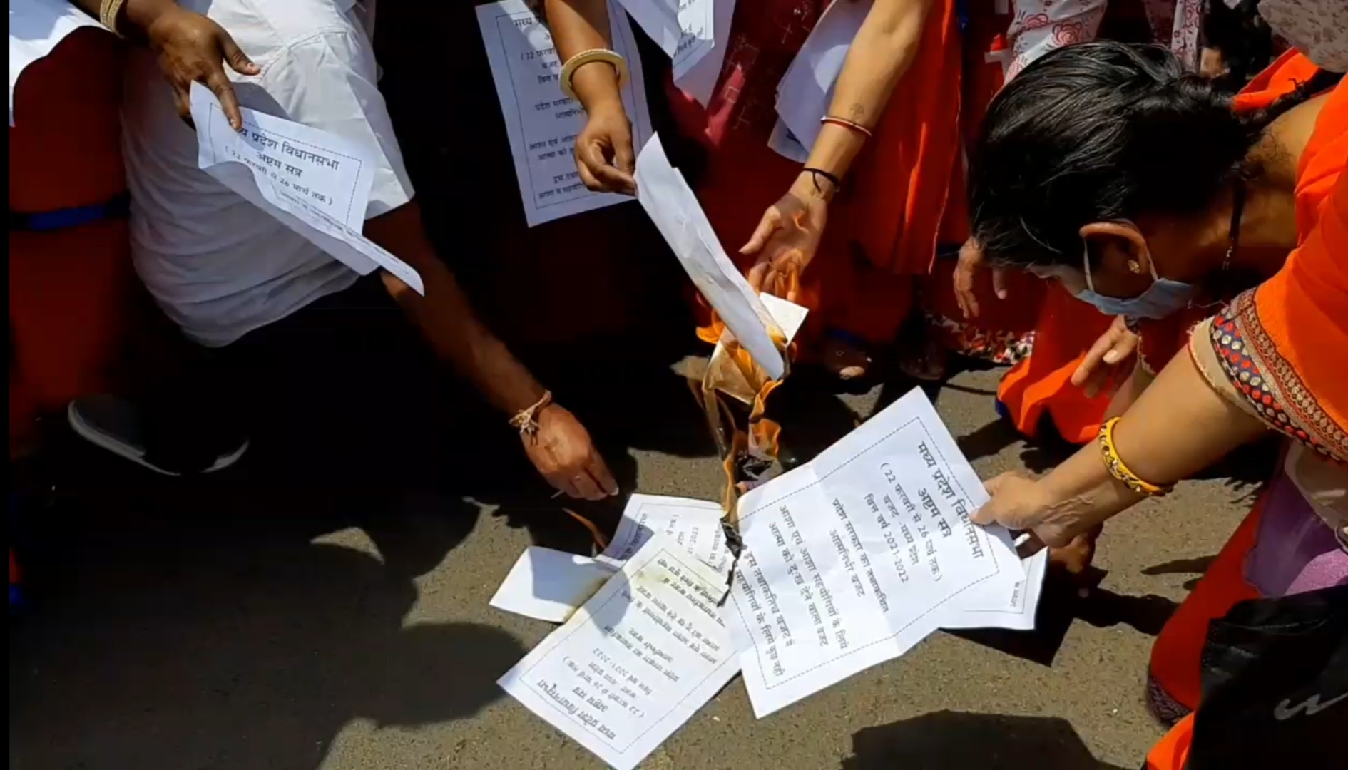 Usha activist burns a symbolic copy of the budget