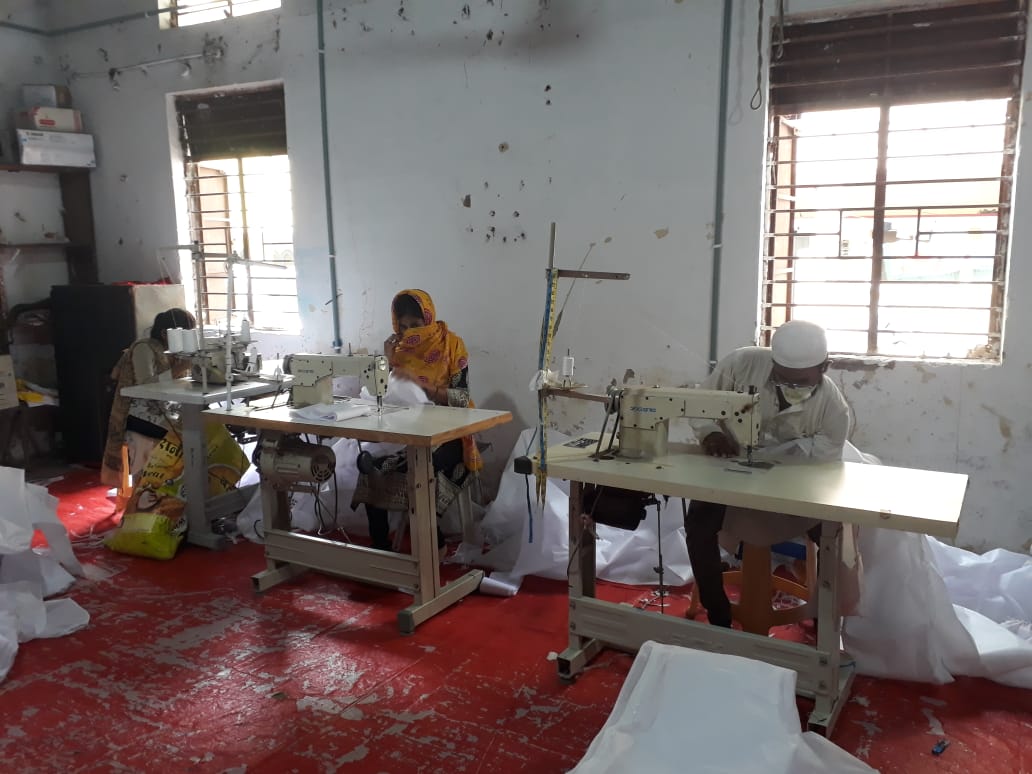 210 women making masks