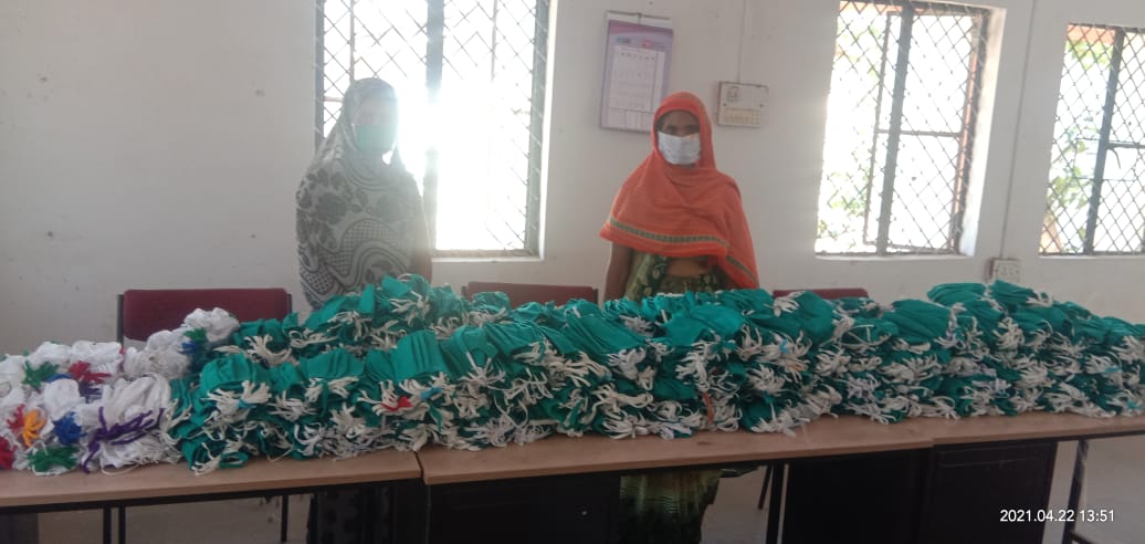 210 women making masks