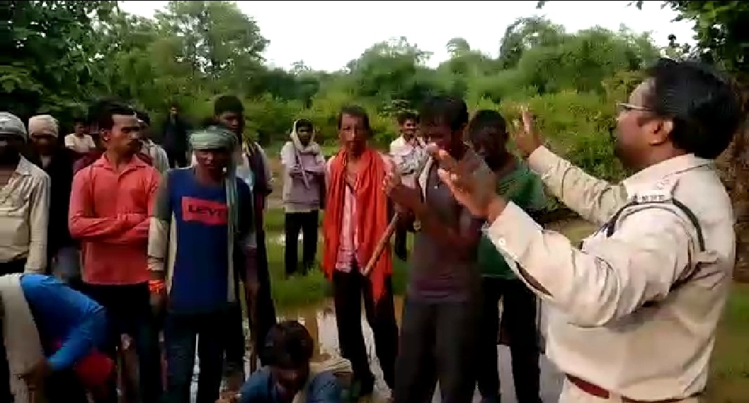 Rangers explaining to the villagers