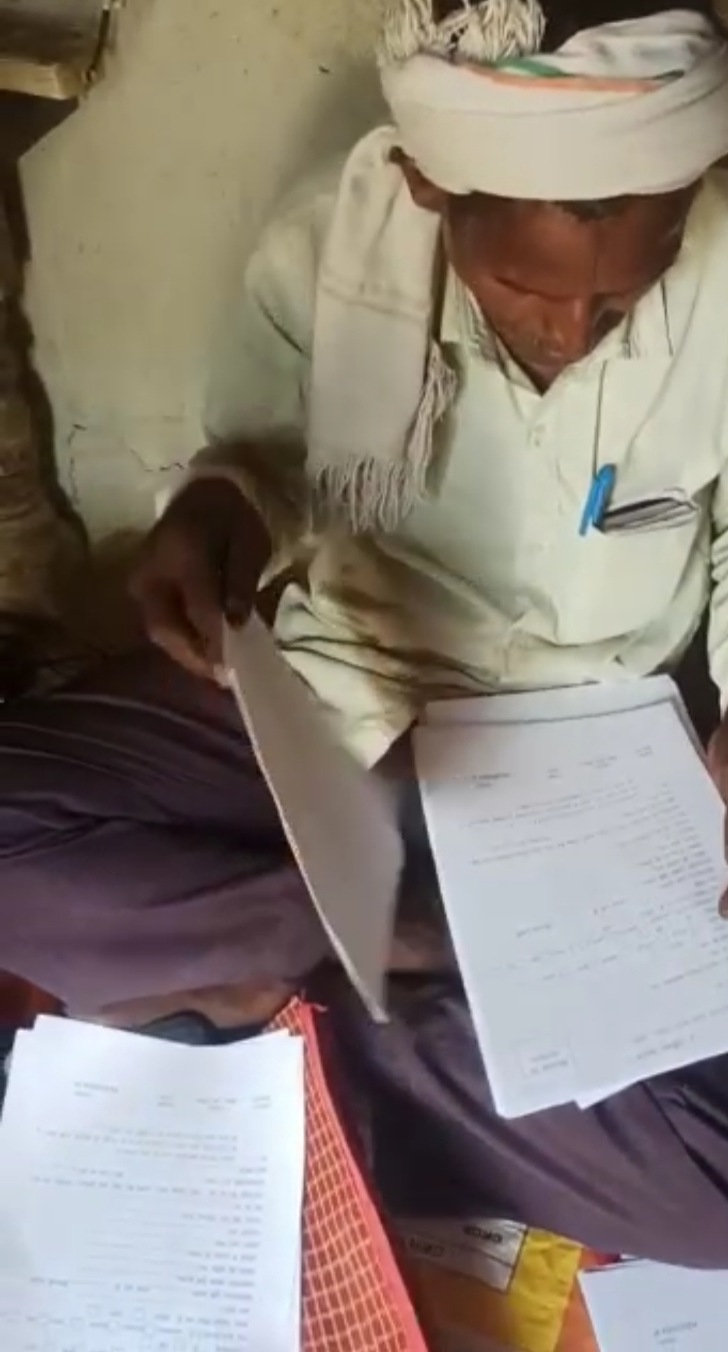 Former sarpanch filling forms of PM Aawas