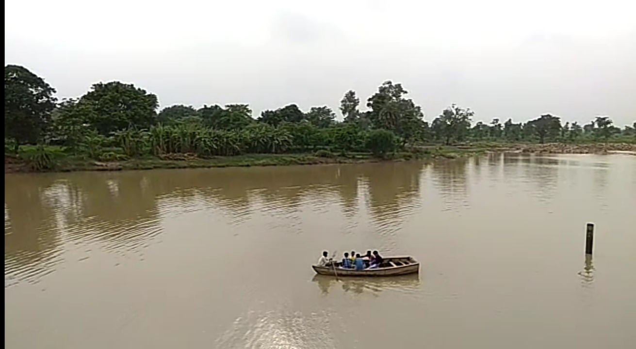 on the coast of Bina river