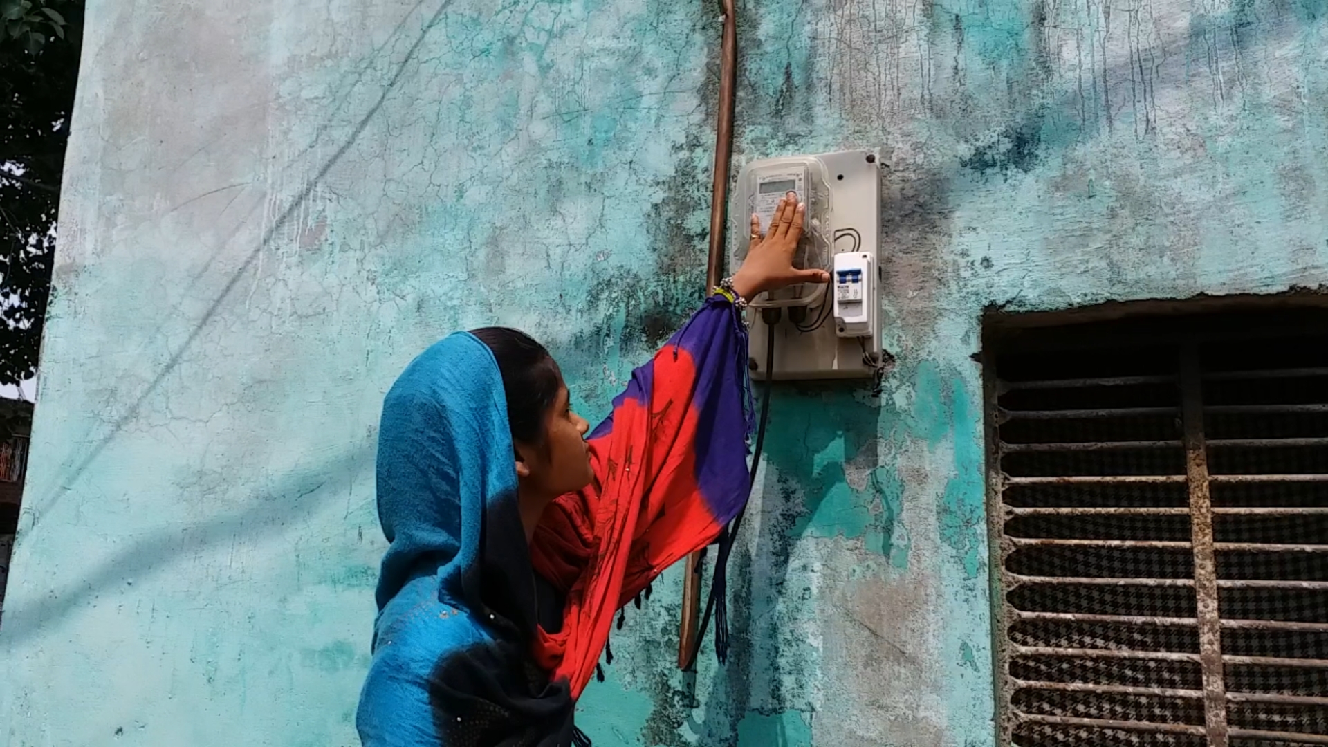 Lady checking meter