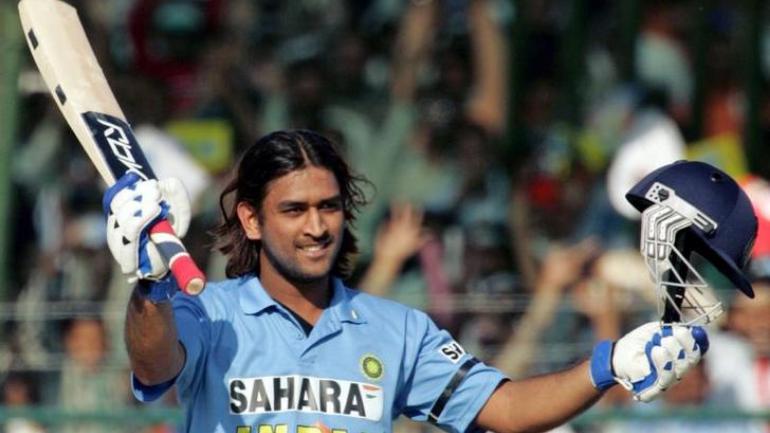 MS Dhoni raises his bat after scoring his maiden ODI ton at Vizag.