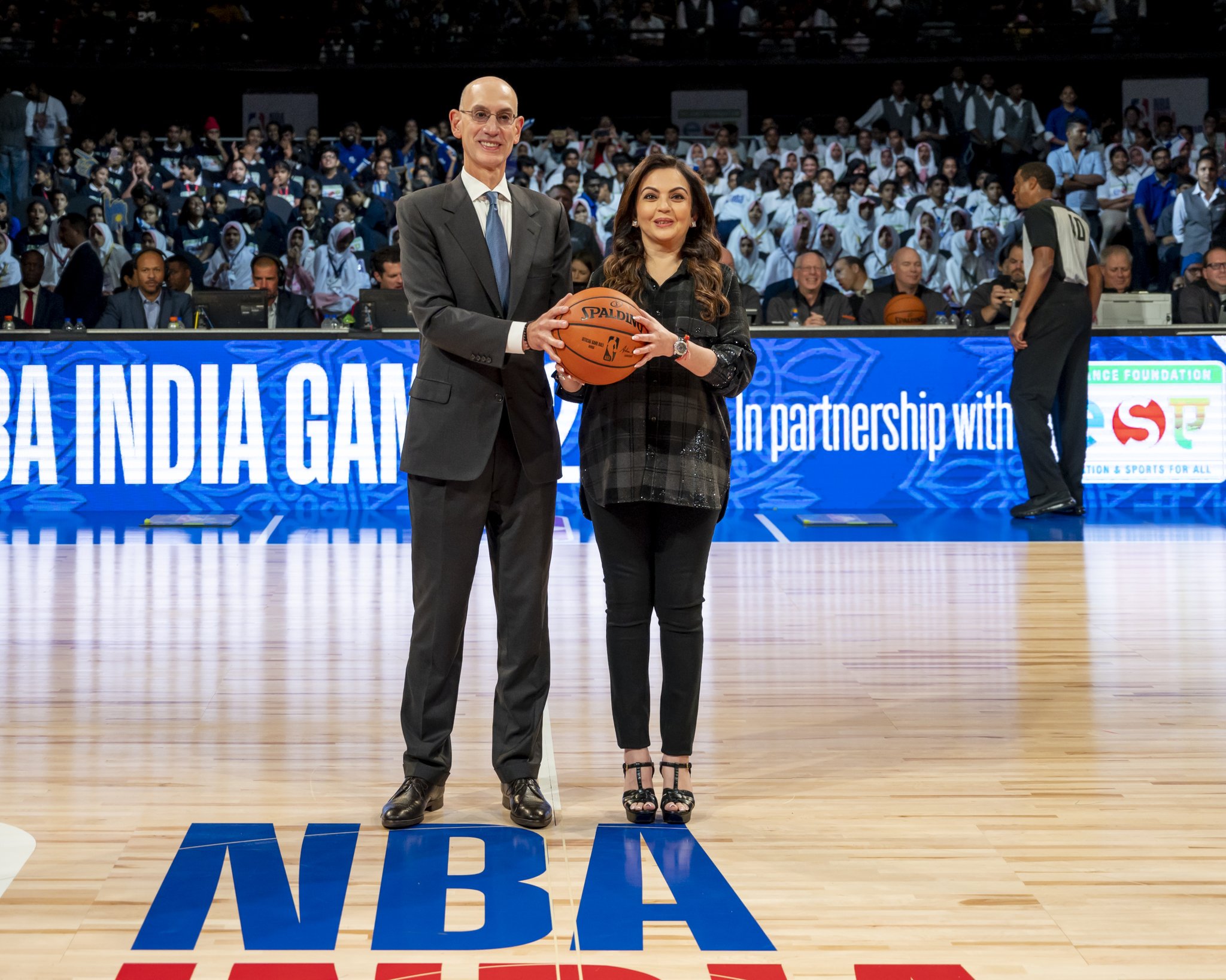 NBA Commissioner Adam Silver Presents The ‘first’ Match Ball of NBA Game In India To Nita Ambani.