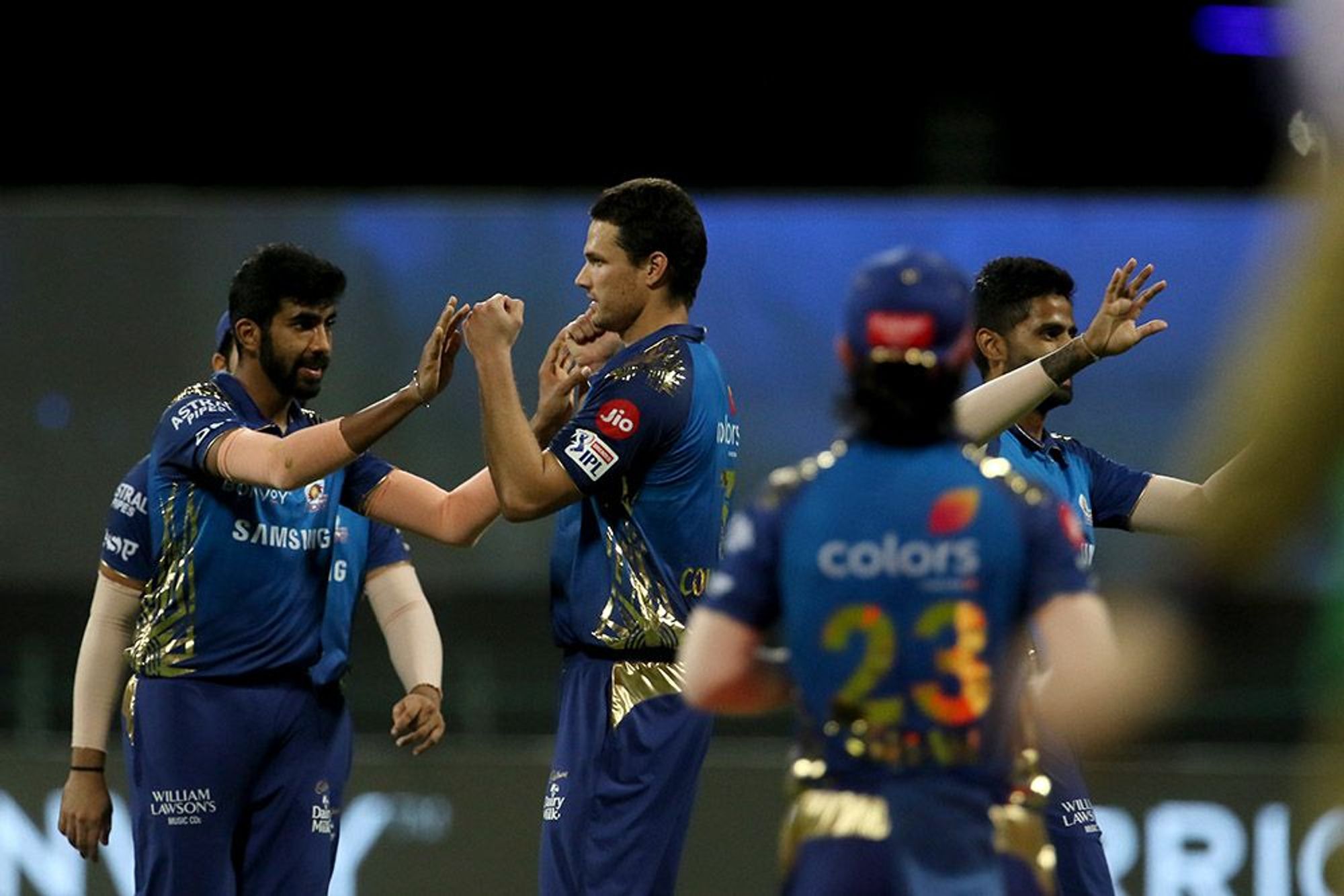 Jasprit Bumrah and Nathan Coulter-Nile celebrate after fall of a KKR wicket.