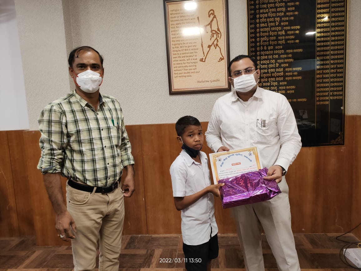 Gajapati Collector felicitate Orphan child ram who lost his parents in Cyclone Titli