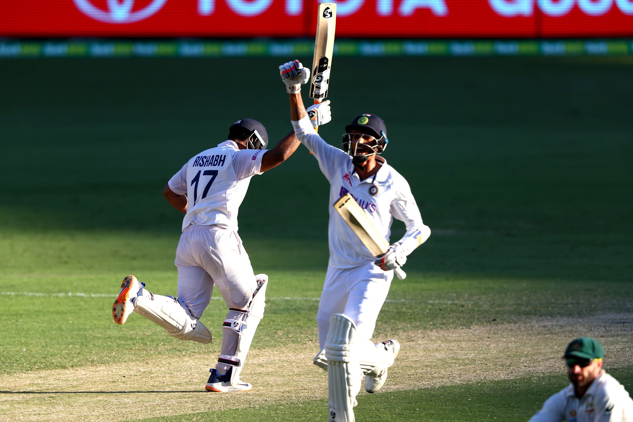 Rishabh Pant and Navdeep Saini celebrate after winning the Brisbane Test on Tuesday.