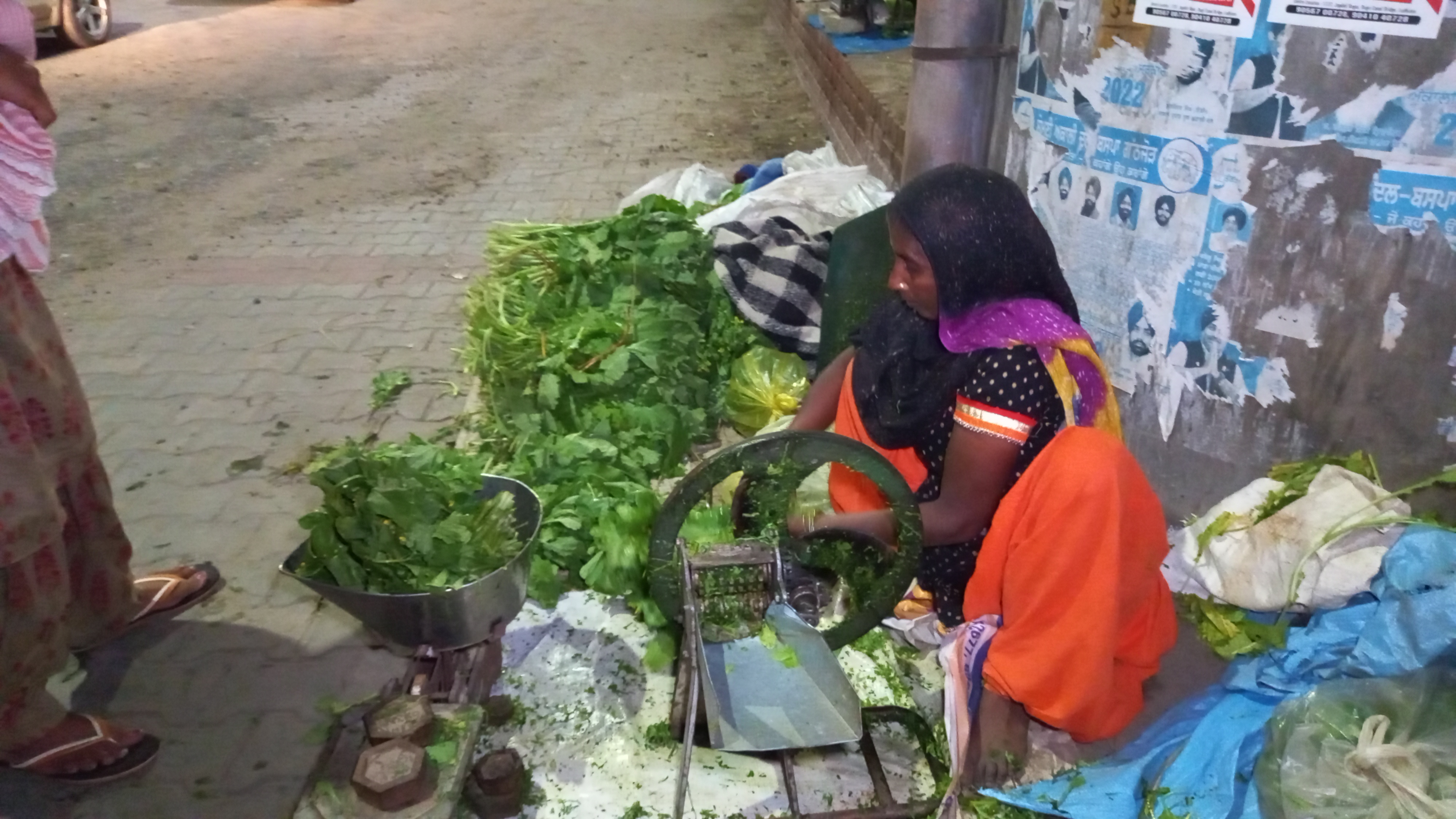 Women sell saag for a living on the road, people in cities take fresh greens from the women