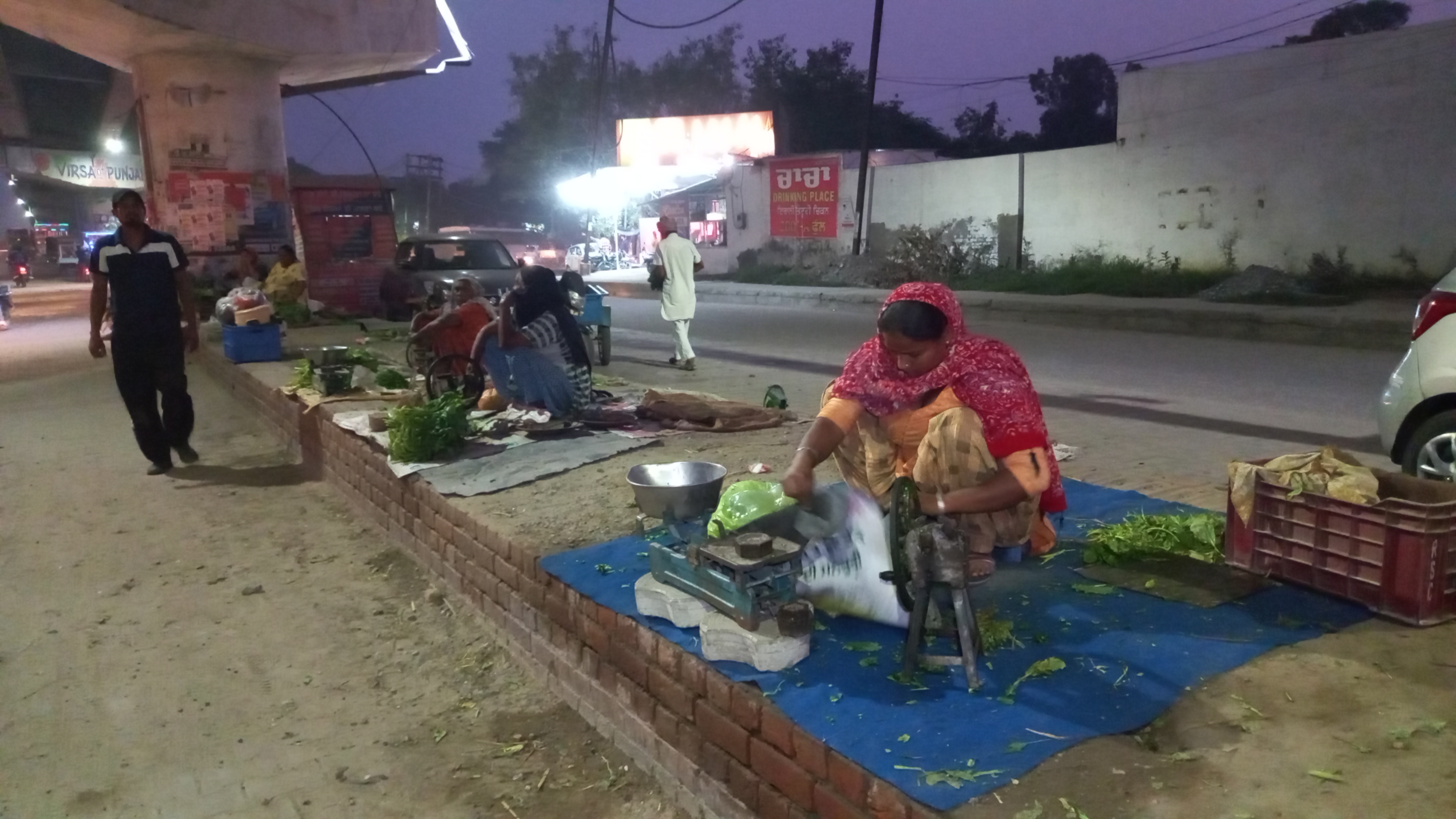 Women sell saag for a living on the road, people in cities take fresh greens from the women