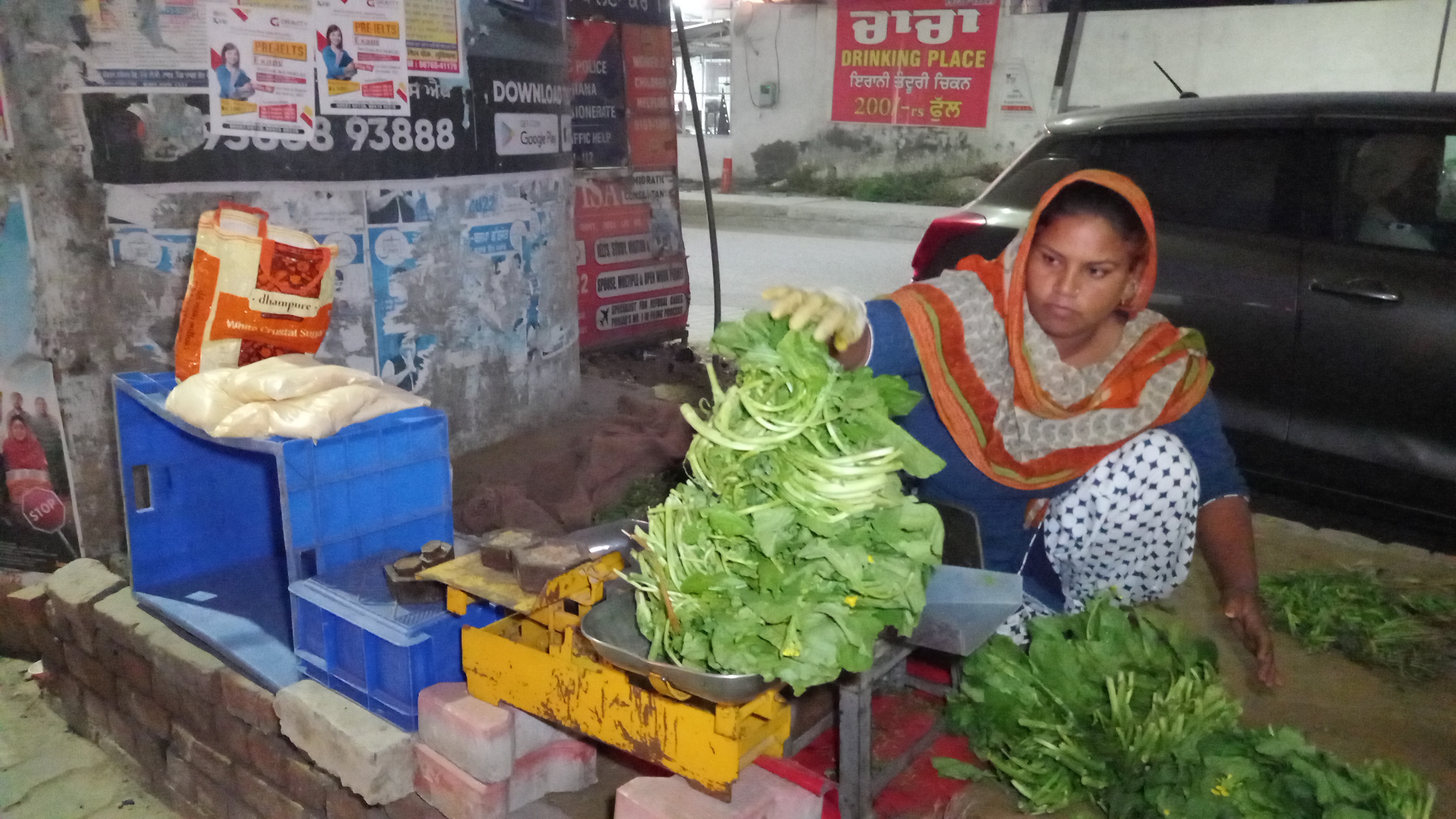 Women sell saag for a living on the road, people in cities take fresh greens from the women