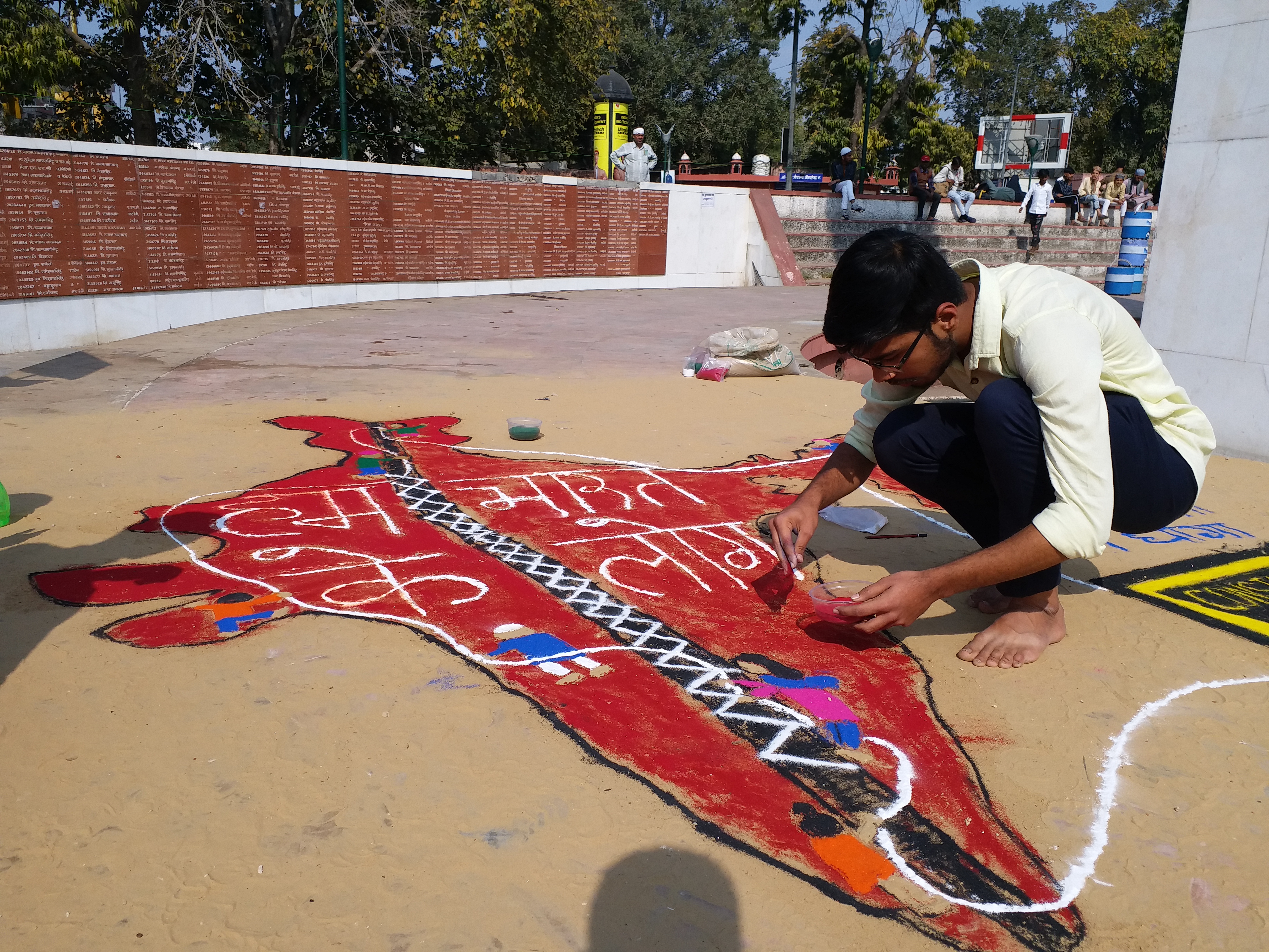 Artists create maps of India and various exhibits at an anti-CAA demonstration by artists at the Jaipur martyr monument