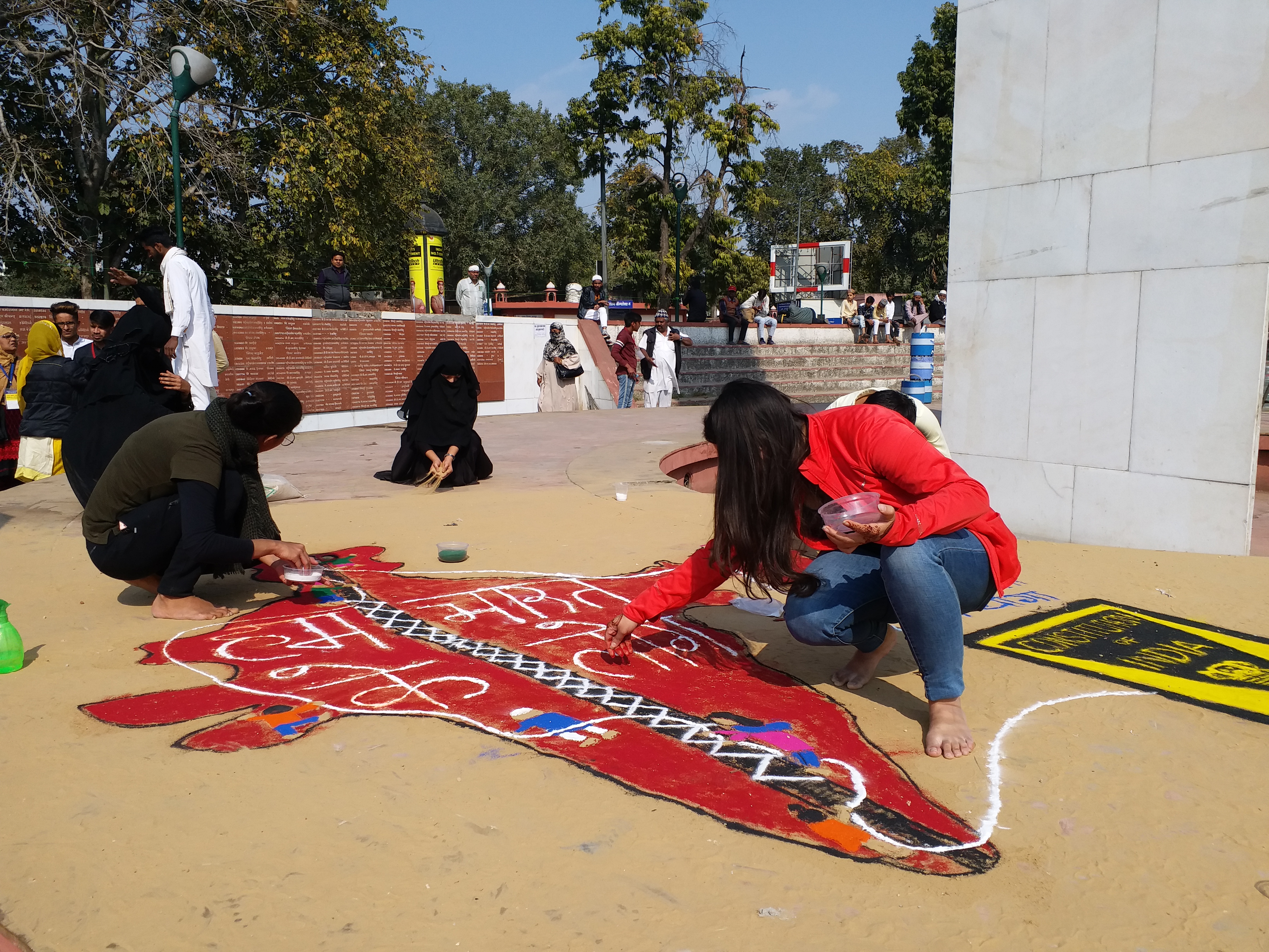 Artists create maps of India and various exhibits at an anti-CAA demonstration by artists at the Jaipur martyr monument