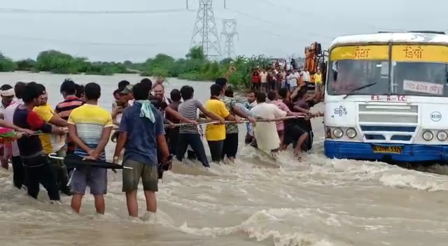 bus driver negligence,  Bus stuck in drain in Kota