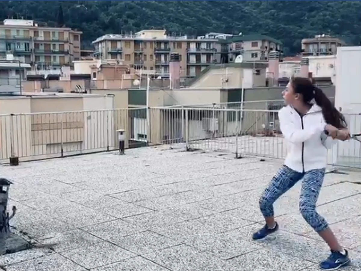 Two Italy women play rooftop tennis