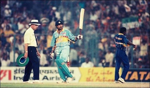 Sachin Tendulkar celebrates after completing his fifty against Sri Lanka in the semifinal.