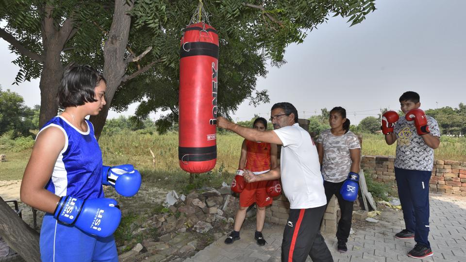 Saheb Singh Narwal is busy in training young boxers in Rohtak's Rithal village.