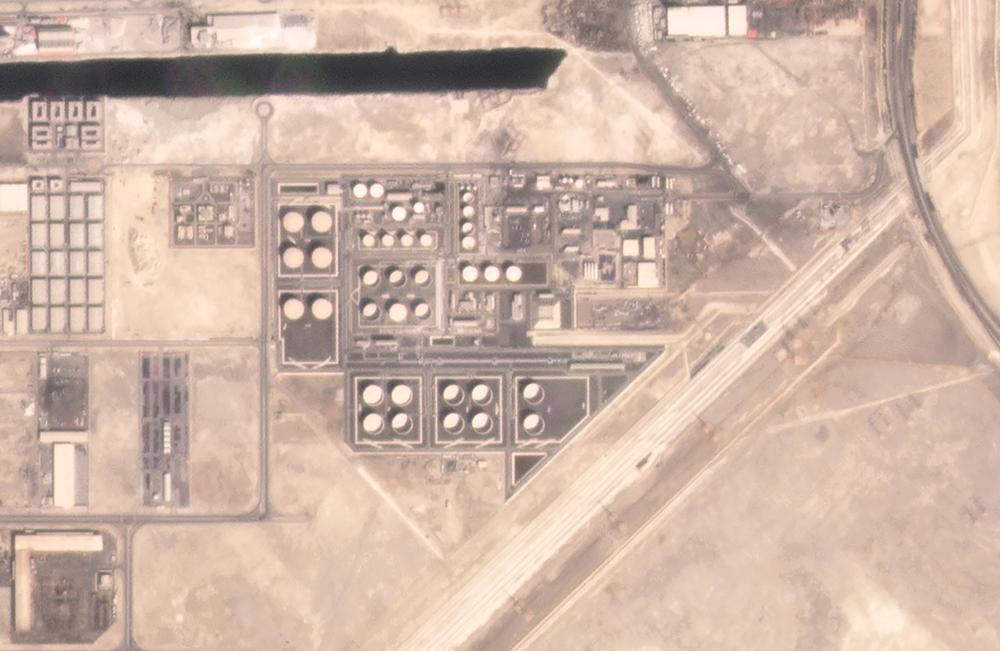 In this satellite image provided by Planet Labs PBC, an Abu Dhabi National Oil Co. fuel depot in the Mussafah neighborhood of Abu Dhabi, United Arab Emirates, is seen Saturday, Jan. 15, 2022, before being targeted in an attack days later. A drone attack claimed by Yemen's Houthi rebels targeting a key oil facility in Abu Dhabi killed three people on Monday, Jan. 17, 2022, and sparked a fire at Abu Dhabi's international airport.