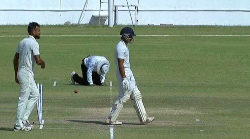 Rajkot, Ranji final, Umpire, ruled out, abdomen