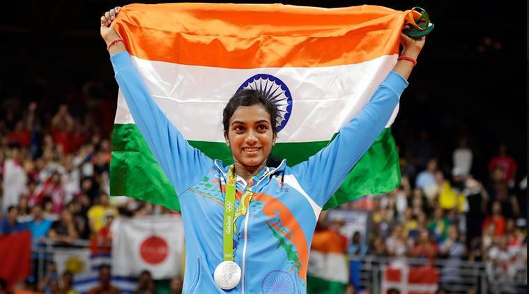 PV Sindhu flaunting the Indian flag after winning the Olympic silver medal.