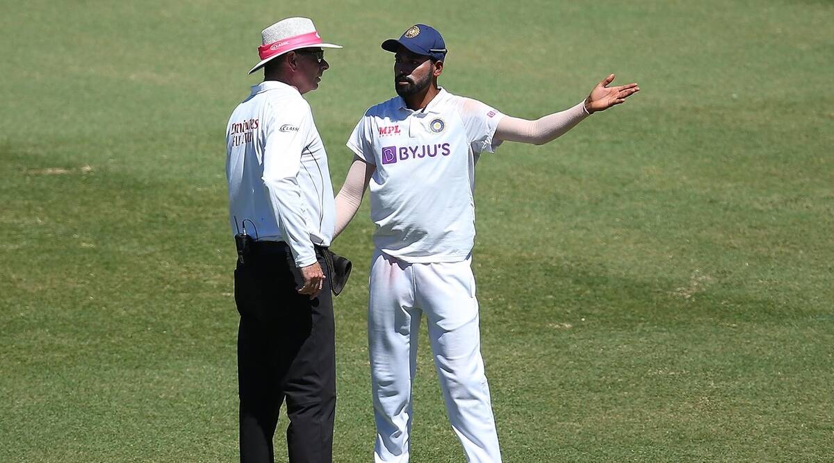 Mohammed Siraj of India stops play to make a formal complaint to Umpire Paul Reiffel about some spectators.