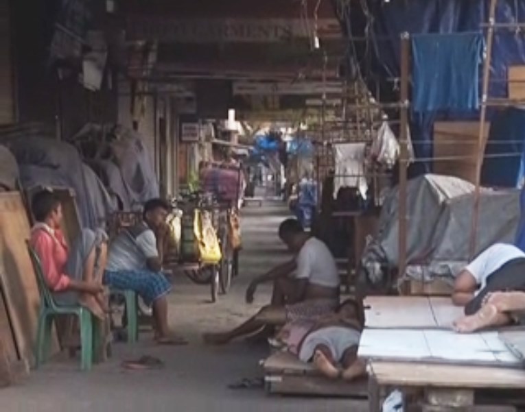 Hawkers sitting idle in a market