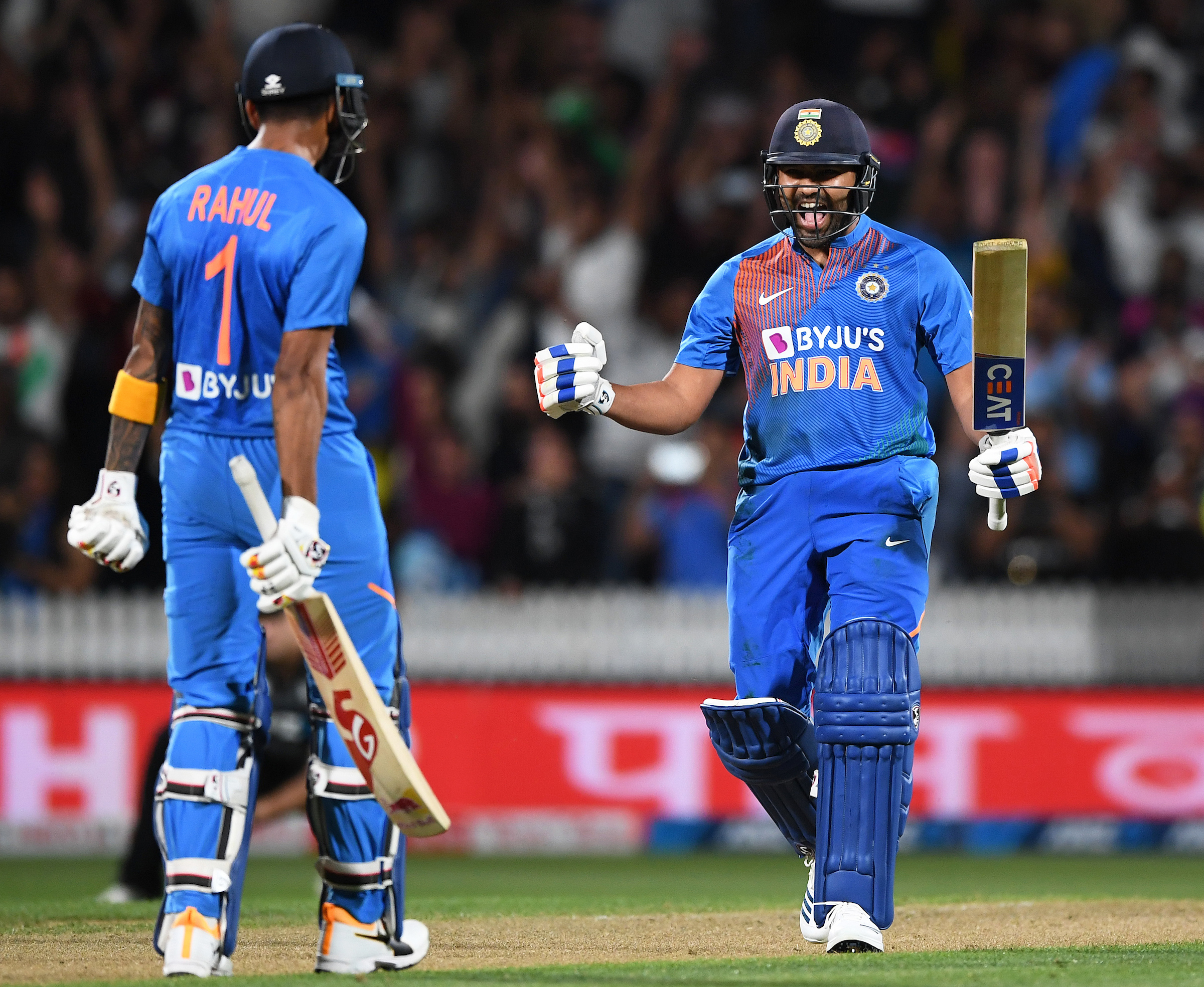 Rohit Sharma and KL Rahul celebrate after winning Tuesday's super-over against New Zealand in Hamilton.