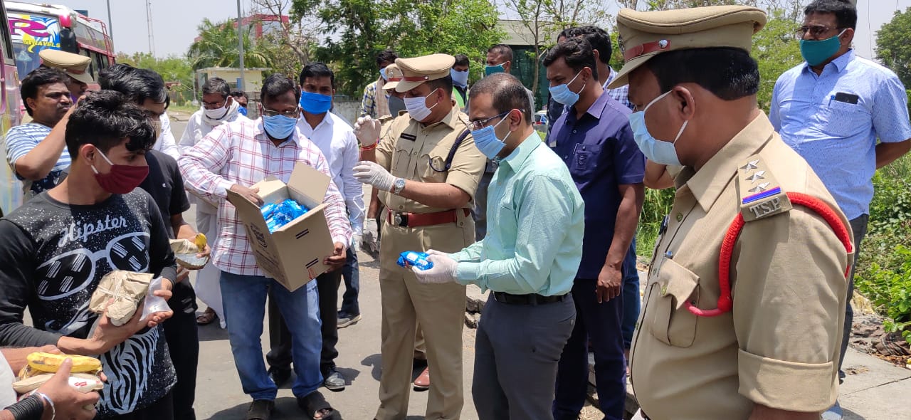 nirmal district police distributing food to migrants